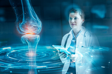 Doctor analyzing digital knee data with advanced medical technology