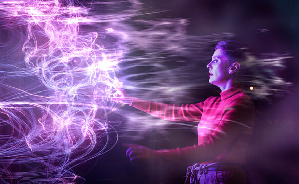 Engineer interacting with AI holographic interface in glowing environment