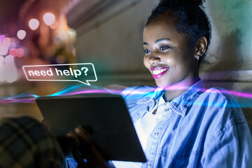 Smiling woman using tablet with AI chat at night outdoors