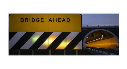 Bridge Ahead Sign Illuminates Approach to a Tunnel Passage During Twilight Hours