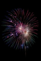 Fototapeta premium Fireworks outdoors night black background.
