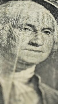 Close up of one dollar bill from 1963 with Washington portrait. Highlights intricate engravings. Paper money used as medium of exchange, legal tender used for transactions in trade and commerce
