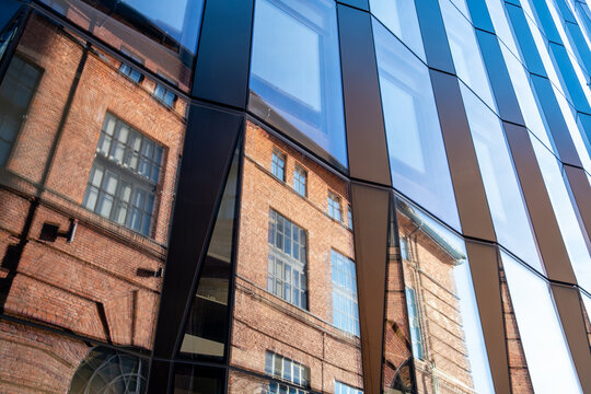 Minimalism and structure shaping a modern architecture facade where geometry, symmetry, reflection, coherent urban design and precise architectural detail align visually