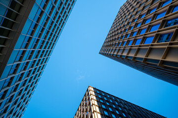 Dynamic geometry and reflection elevating a modern architecture facade that blends symmetry, structure, minimalism, cohesive urban design and accurate architectural detail