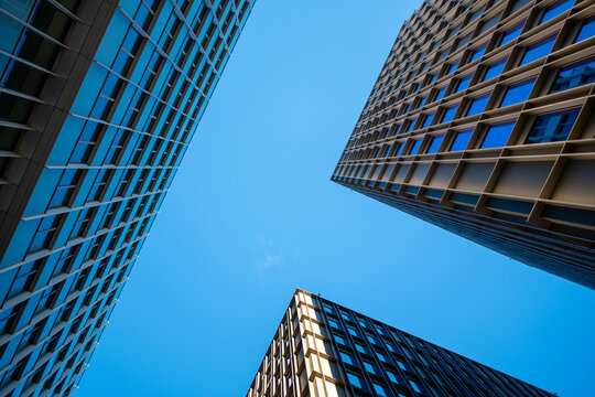 Dynamic geometry and reflection elevating a modern architecture facade that blends symmetry, structure, minimalism, cohesive urban design and accurate architectural detail