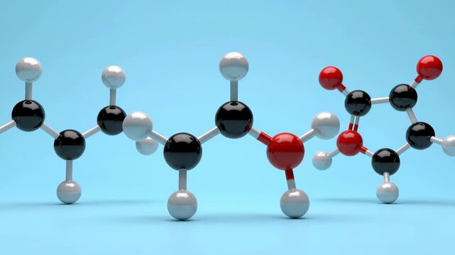 Close-up of molecular structures featuring white and black atoms against a light blue backdrop, illustrating complex molecular chemistry models for scientific understanding.