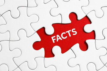 Fototapeta premium puzzle showing facts on red