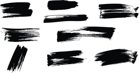 Black paint brush strokes set on white background with rough edges and varied shapes for design use
