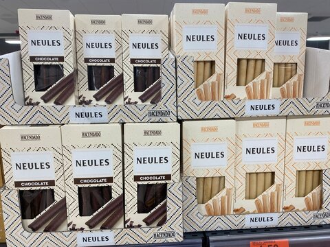 Palmanova, Spain - November 12, 2025: Neules cookies in chocolate and vanilla packaging displayed on supermarket shelf, showcasing delicious treats for dessert lovers and snack enthusiasts