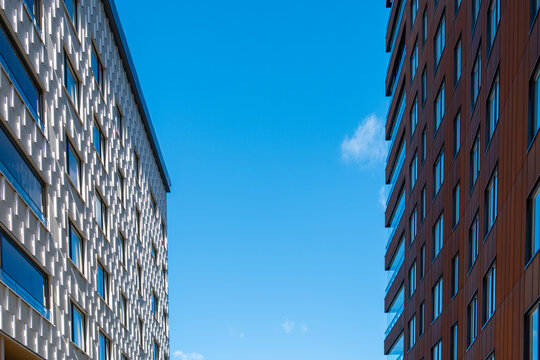 Architecture housing marked by strong vertical facade contrast and modern minimalism reinforcing the evolving urban development of Liljeholmen Stockholm