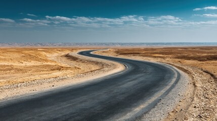 Fototapeta premium Winding road through a desert landscape