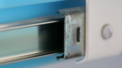 Retractable Desk Slide Mechanism Showing Smooth Plastic Drawer Motion with Metal Guides, Close-Up Engineering Detail, Functional Furniture Hardware Action, Home Workspace Optimization