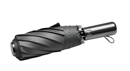 A closed black umbrella with a metallic handle resting on a black surface in a studio setting