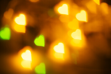 Yellow and light green heart bokeh, festive abstract real photo for wallpapers and prints
