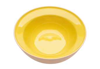 Isolated bright yellow ceramic bowl sits on a table ready to be filled with food, kitchenware