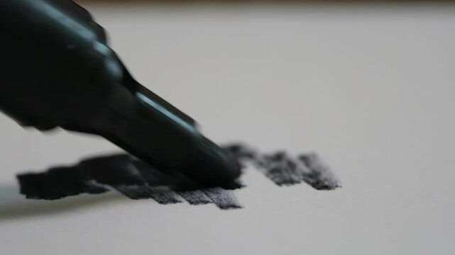 Black Permanent Marker Writing on Clean White Paper Leaving Bold Black Trail Macro Office Planning Education Concept Detailed Visual with Loud Friction Audio Sound Effects Background Noise