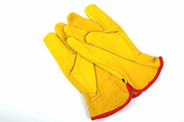 one pair of yellow leather gloves on a white background 