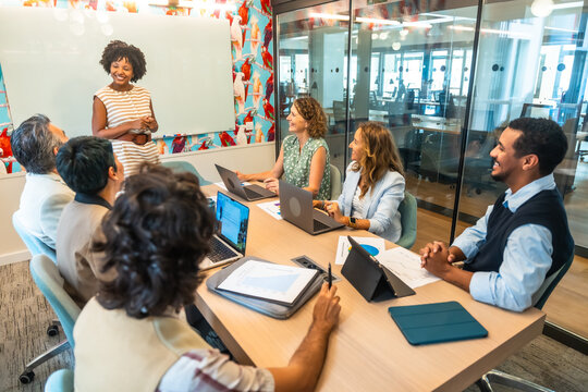 Diverse business team collaborating during office presentation meeting
