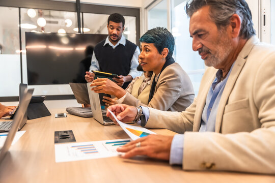 Business colleagues collaborating in a diverse office meeting room