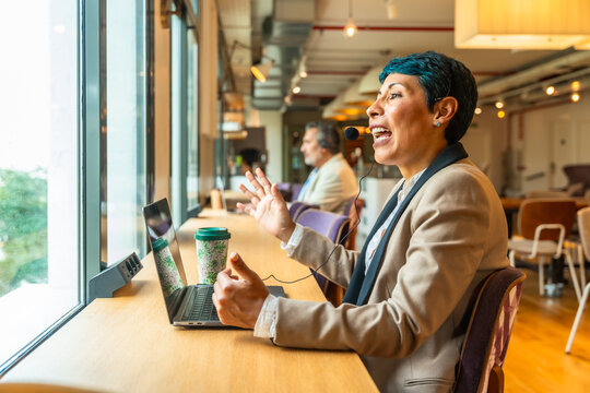 Businesswoman having video call in coworking office