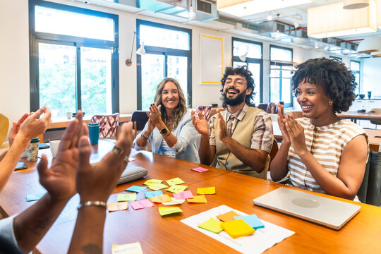 Diverse business team clapping during successful office meeting