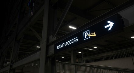 Illuminated Ramp Access Sign Directing To Parking Area In Dimly Lit Building