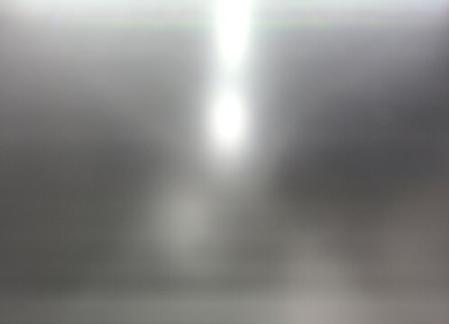 blurry metallic surface with bright light
