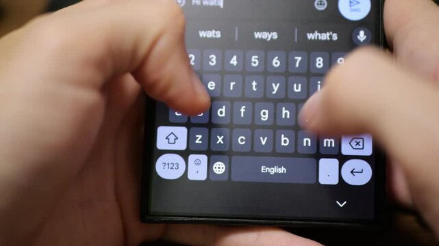 Modern Smartphone with Dark Energy-Saving Theme Displaying Keyboard Typing Sounds, Efficient Text Entry, Mobile Device Energy Conservation Concept, close-up on Digital Interaction, Contemporary 