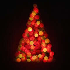 Christmas tree made of glowing bokeh lights on black background. Festive holiday decoration concept.