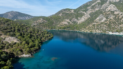 Aerial summer travel scene showing &Ouml;l&uuml;deniz Blue Lagoon&rsquo;s vivid turquoise sea