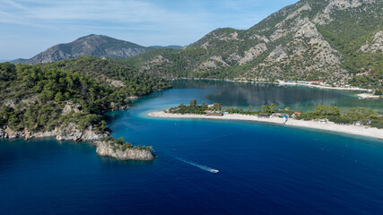 Scenic aerial footage capturing the bright blue lagoon and surrounding natural beauty.