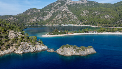 Scenic aerial footage capturing the bright blue lagoon and surrounding natural beauty.