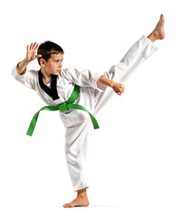 Young boy in green belt showing a high kick on isolated background