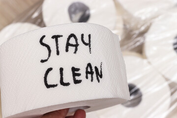 A roll of paper with the handwritten message Stay Clean promoting hygiene. This essential item is often used in bathrooms and kitchens for cleanliness.