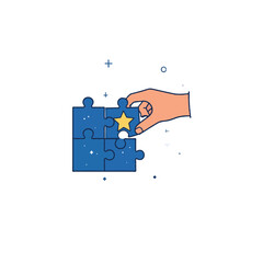 Hand holding jigsaw piece completing blue puzzle with star concept of solution finding teamwork