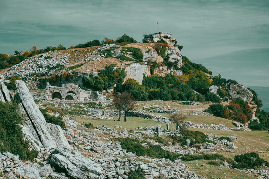 An autumn landscape decorated with yellow, red, and orange leaves in Burdur Bucak. The road to the ancient city of Kremna and the scenery in the autumn atmosphere. - Powered by Adobe