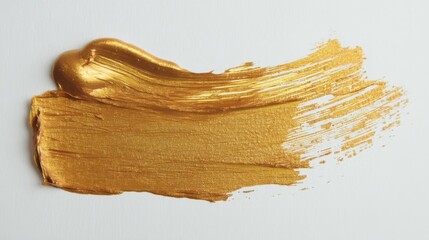 Gold paint brush strokes on white paper with smooth texture and slight foreshortening in some areas.
