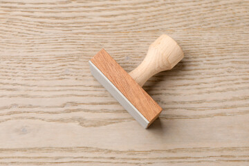 One wooden stamp on table, top view. Space for text