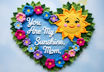  Crochet sun with flowers and leaves forming a heart around “You Are My Sunshine, Mom,”