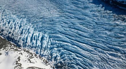 Aerial View of Blue Glacier Ice Formation and Mountain Landscape