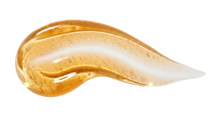 Golden luminous serum smear forming elegant curve on bright white surface 