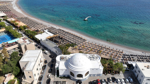 Aerial drone photo of popular sandy organized beach of Elli famous for restaurants and bars near main town of Rhodes island, Dodecanese, Greece