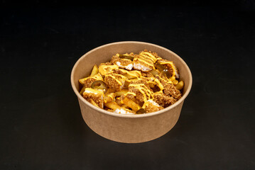 fried chicken with roasted new potatoes in garlic butter, parsley, and lemon wedges for squeezing.