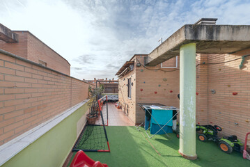 Complete design of a top-floor terrace with a full stainless steel outdoor kitchen, including a built-in gas barbecue and synthetic rattan furniture