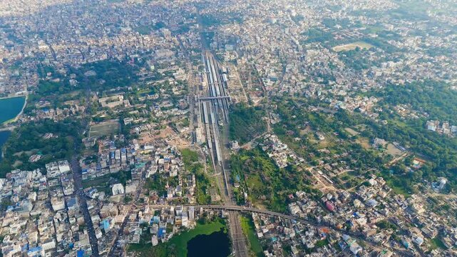 Top down cross traffic highway with cars, trucks aerial. Urban transportation at bridge road at Delhi. Cinematic cityscape of freeway drone shot. Noida Freeway.