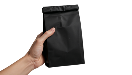 Hand holding a simple unbranded black paper bag for retail or gift packaging