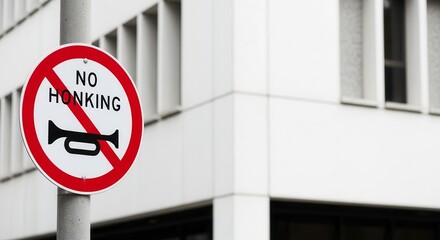 Prohibition Sign Against Honking Depicted in an Urban, Architectural Surrounding