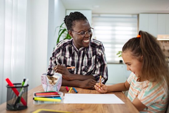 Creative bonding time with art between a child and adult indoors