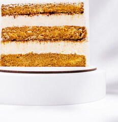Delicious layered cake with creamy frosting showcases rich textures
