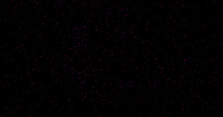 Obraz premium Red dust particles of varying sizes and transparency on a black background. Abstract glowing effect with a festive atmosphere.